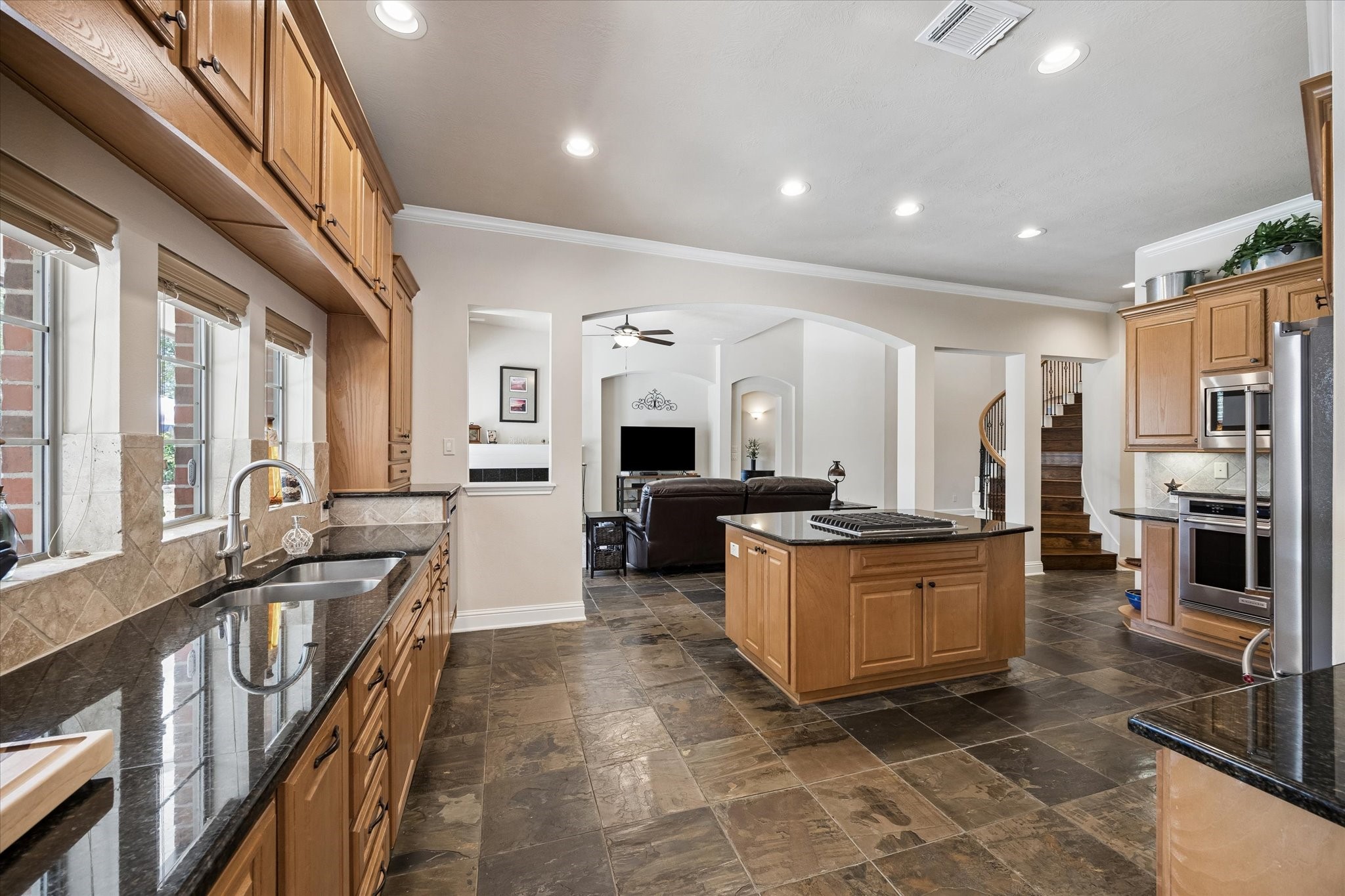 3902 Trailstone Lane Katy, TX 77494 - Photo 14 of 50 The kitchen keeps everyone connected with ample prep space, tons of cabinetry, and an easy flow into the family room, so conversations can keep going long after dinner is served.