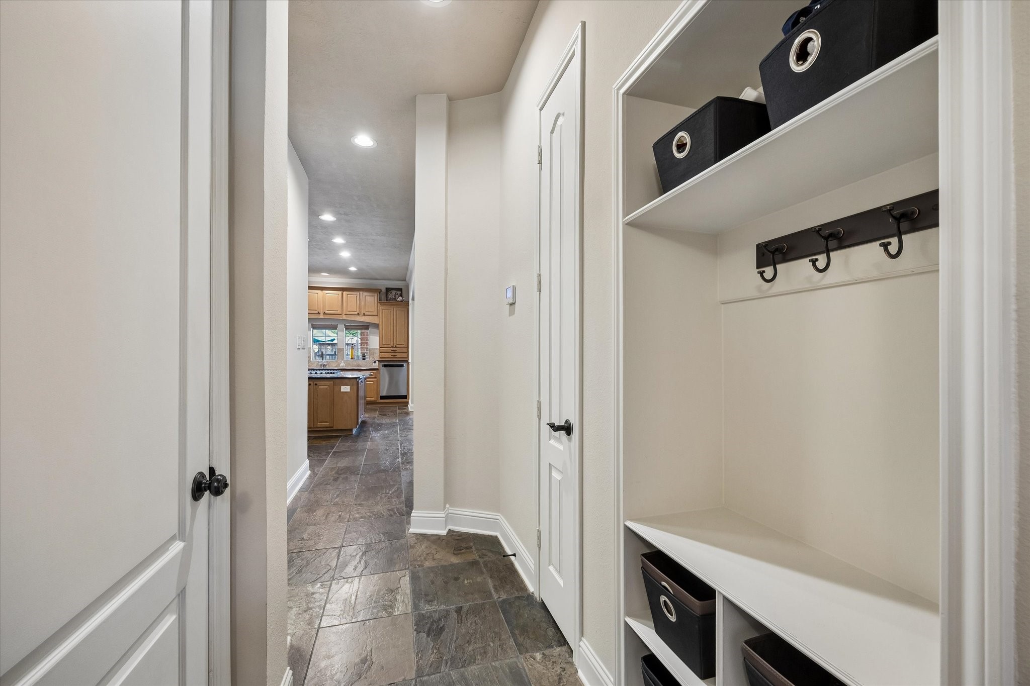 3902 Trailstone Lane Katy, TX 77494 - Photo 19 of 50 Smart built-in storage gives this hallway drop zone a place for shoes, bags, jackets, and all the everyday extras that need to stay organized and within easy reach.