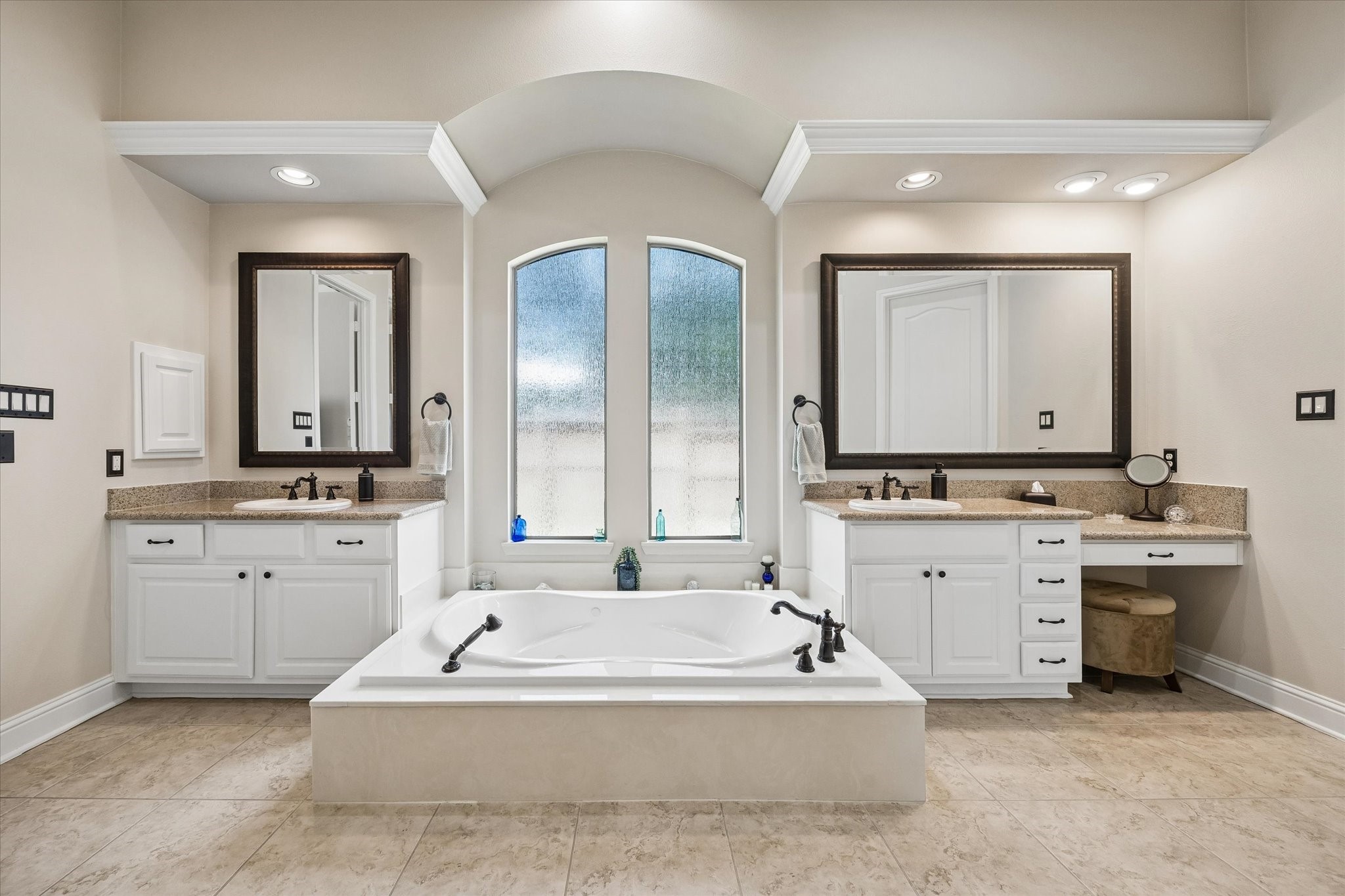 3902 Trailstone Lane Katy, TX 77494 - Photo 23 of 50 This beautifully designed ensuite invites you to slow down and relax with separate vanities, a jetted tub, an oversized walk-in shower, elegant finishes, and a spacious layout that feels like a private spa.