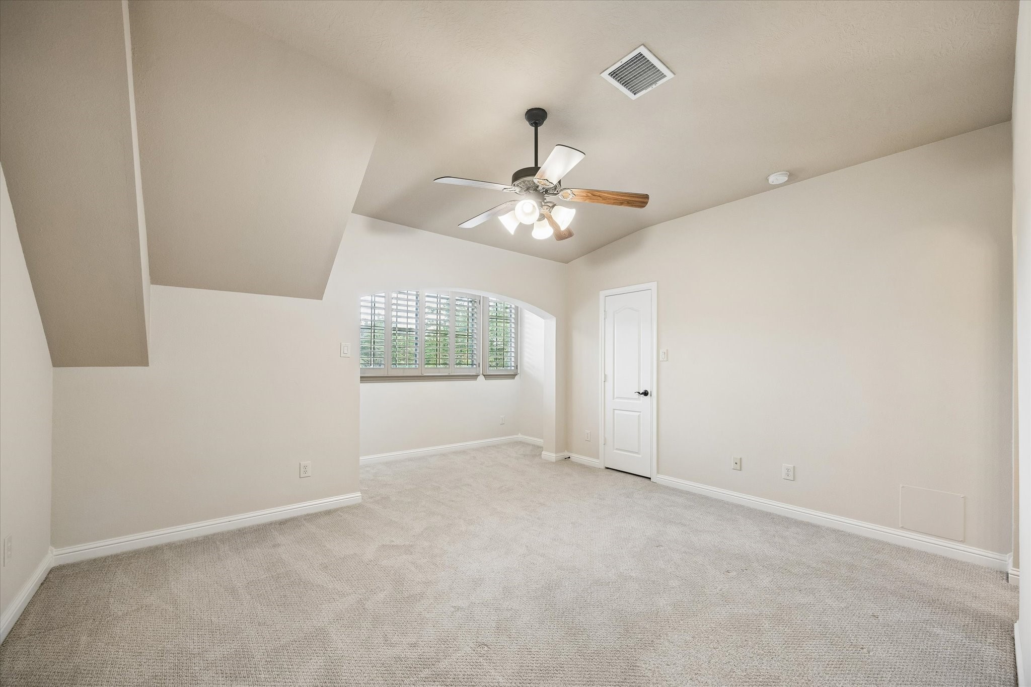 3902 Trailstone Lane Katy, TX 77494 - Photo 30 of 50 Guests will feel right at home in this spacious bedroom. This spacious bedroom offers plush carpet, neutral paint, a lit ceiling fan, a sitting area under wood-shuttered windows, a large closet and easy access to a full bathroom.