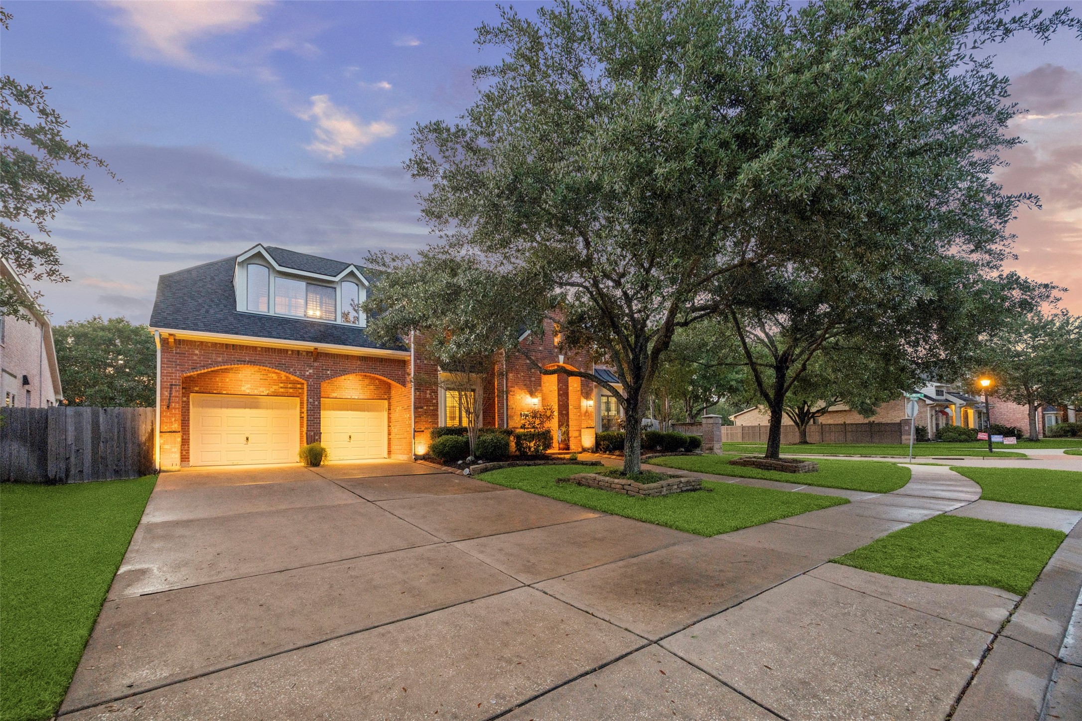 3902 Trailstone Lane Katy, TX 77494 - Photo 3 of 50 This impressive corner-lot location offers the kind of setting you are going to love, with a greenbelt wrapping behind and along the side for added privacy and breathing room. The porte-cochere, mature trees, and 3-car tandem garage make the exterior every bit as memorable as what waits inside.