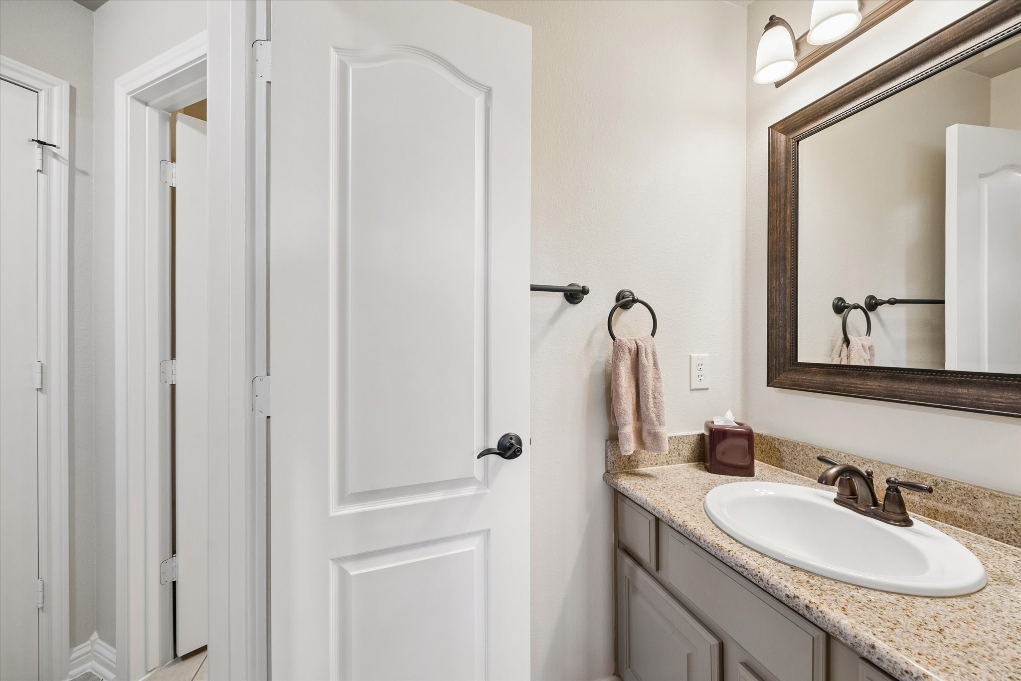 3902 Trailstone Lane Katy, TX 77494 - Photo 33 of 50 Morning routines will be a snap with this Hollywood-style bathroom, where two guest bedrooms each enjoy a private vanity while sharing a central water closet.