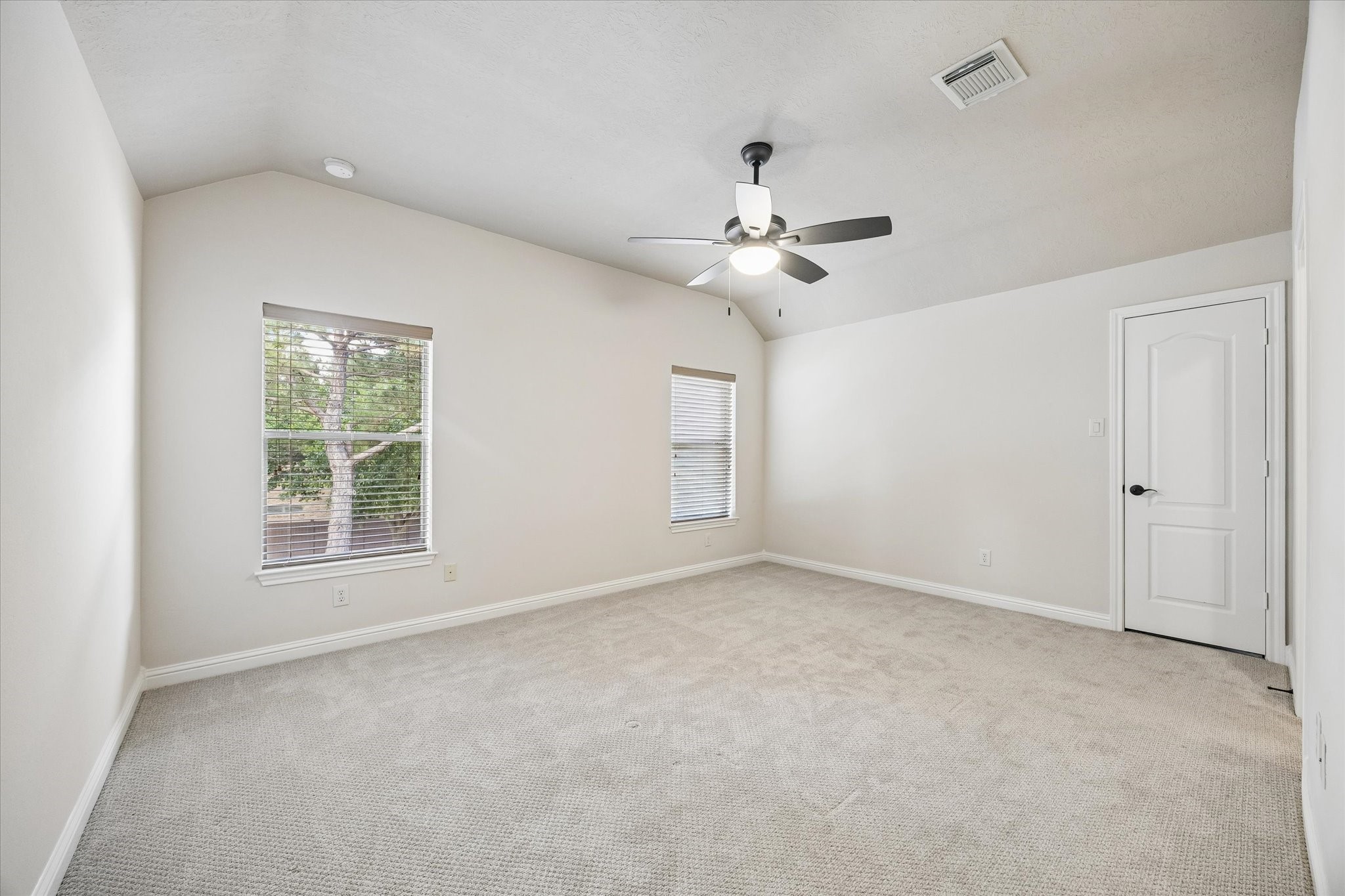 3902 Trailstone Lane Katy, TX 77494 - Photo 34 of 50 Family or guests will rest comfortably in this spacious guest bedroom. This bedroom has plush carpet, neutral paint, a lit ceiling fan, a large closet and easy access to a full bathroom.