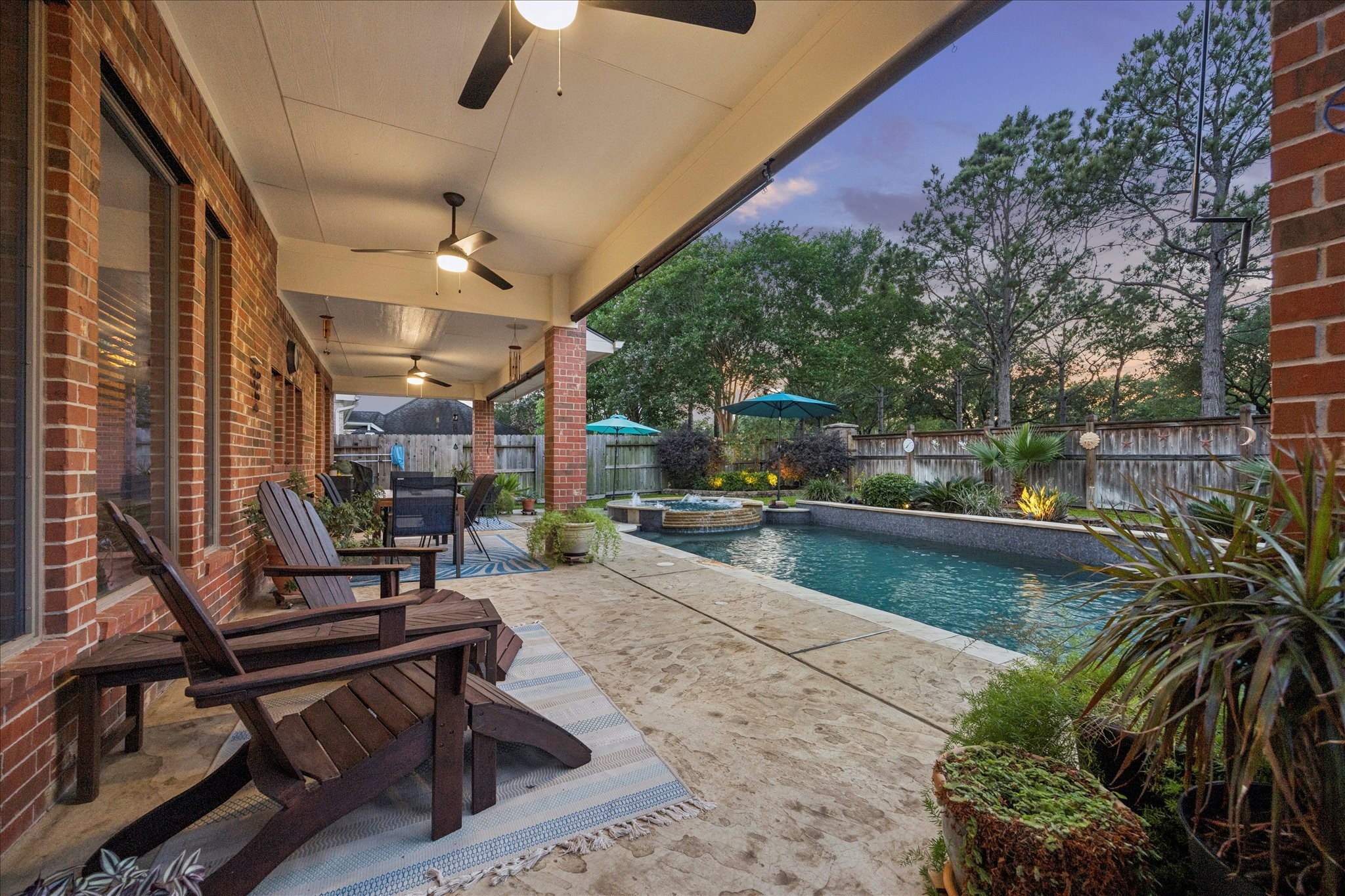 3902 Trailstone Lane Katy, TX 77494 - Photo 37 of 50 When the party moves outside, this covered poolside patio is more than ready, offering a comfortable place to dine, relax, and watch the fun unfold.