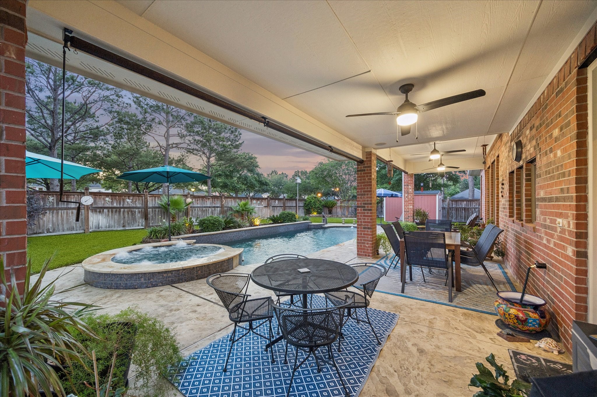 3902 Trailstone Lane Katy, TX 77494 - Photo 38 of 50 This poolside covered patio is ready for long lunches, weekend barbecues, and easy outdoor living, with multiple fans helping everyone stay cool while the good times roll.