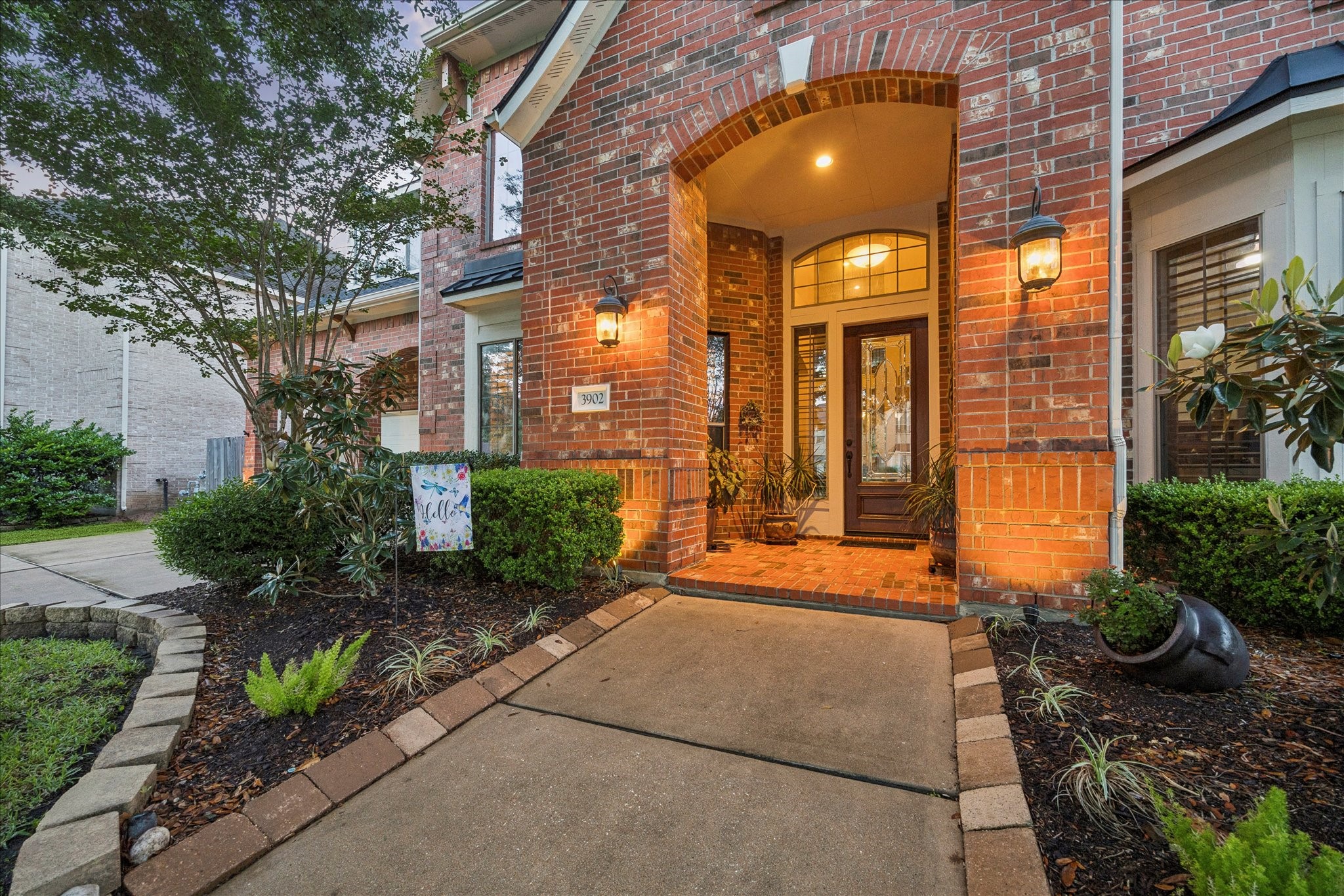 3902 Trailstone Lane Katy, TX 77494 - Photo 4 of 50 From the moment you arrive, this Trendmaker home makes a lasting impression with beautiful curb appeal, a welcoming entry, and lush landscaping. Set on a nearly 1/4-acre corner lot with the greenbelt behind and alongside the home, the setting feels open, scenic, and truly something special.
