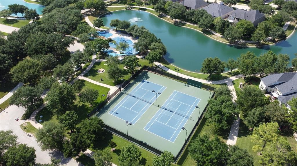 3902 Trailstone Lane Katy, TX 77494 - Photo 48 of 50 Lakeside tennis courts, neighborhood parks, and winding trails make it easy to stay active, get outside, and enjoy the beautiful Grand Lakes setting every day.