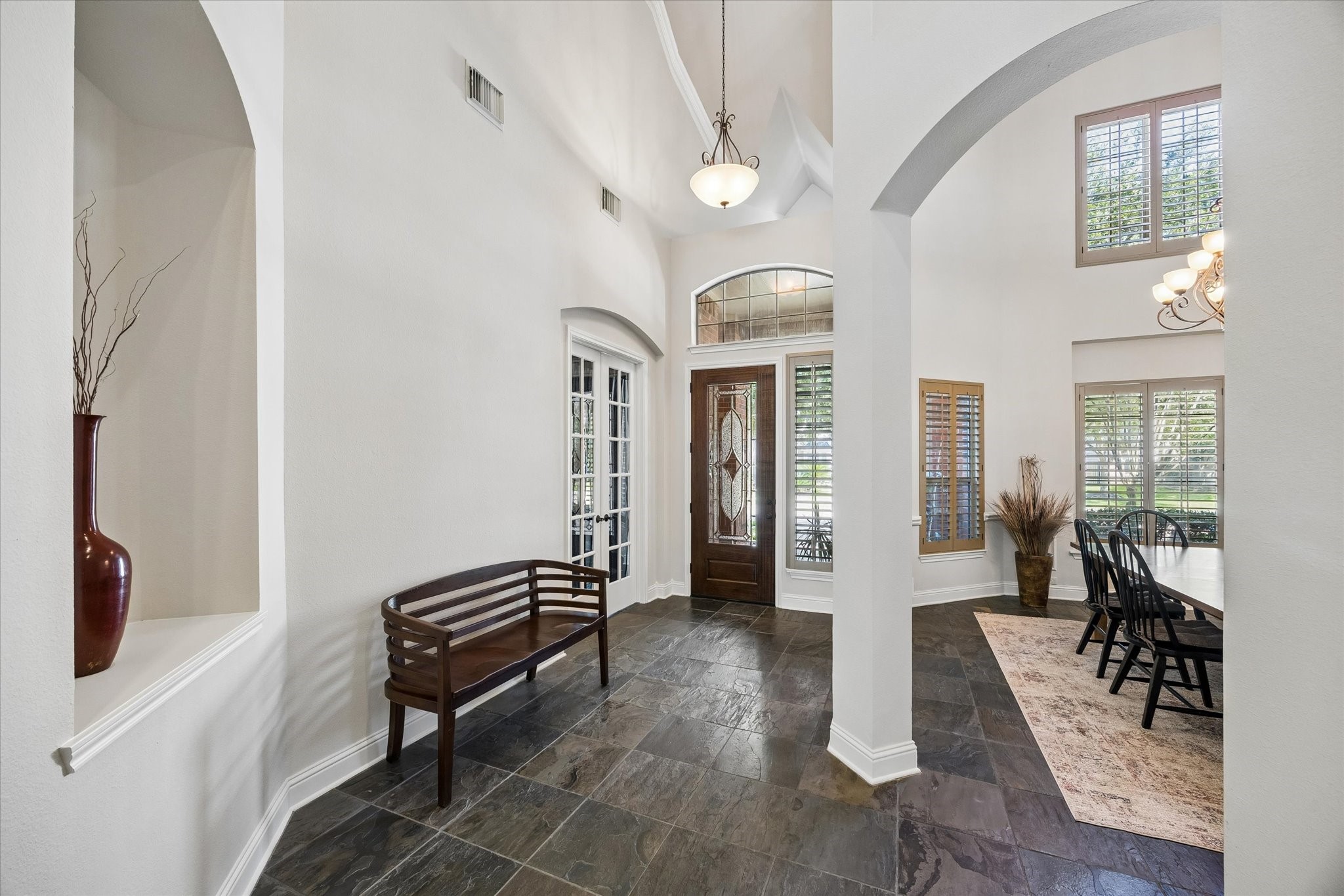 3902 Trailstone Lane Katy, TX 77494 - Photo 6 of 50 This foyer knows how to make an entrance. Towering ceilings, beautiful natural light, slate flooring, and striking architectural details come together to create a welcome that feels instantly grand, elegant, and full of anticipation for everything still to come.