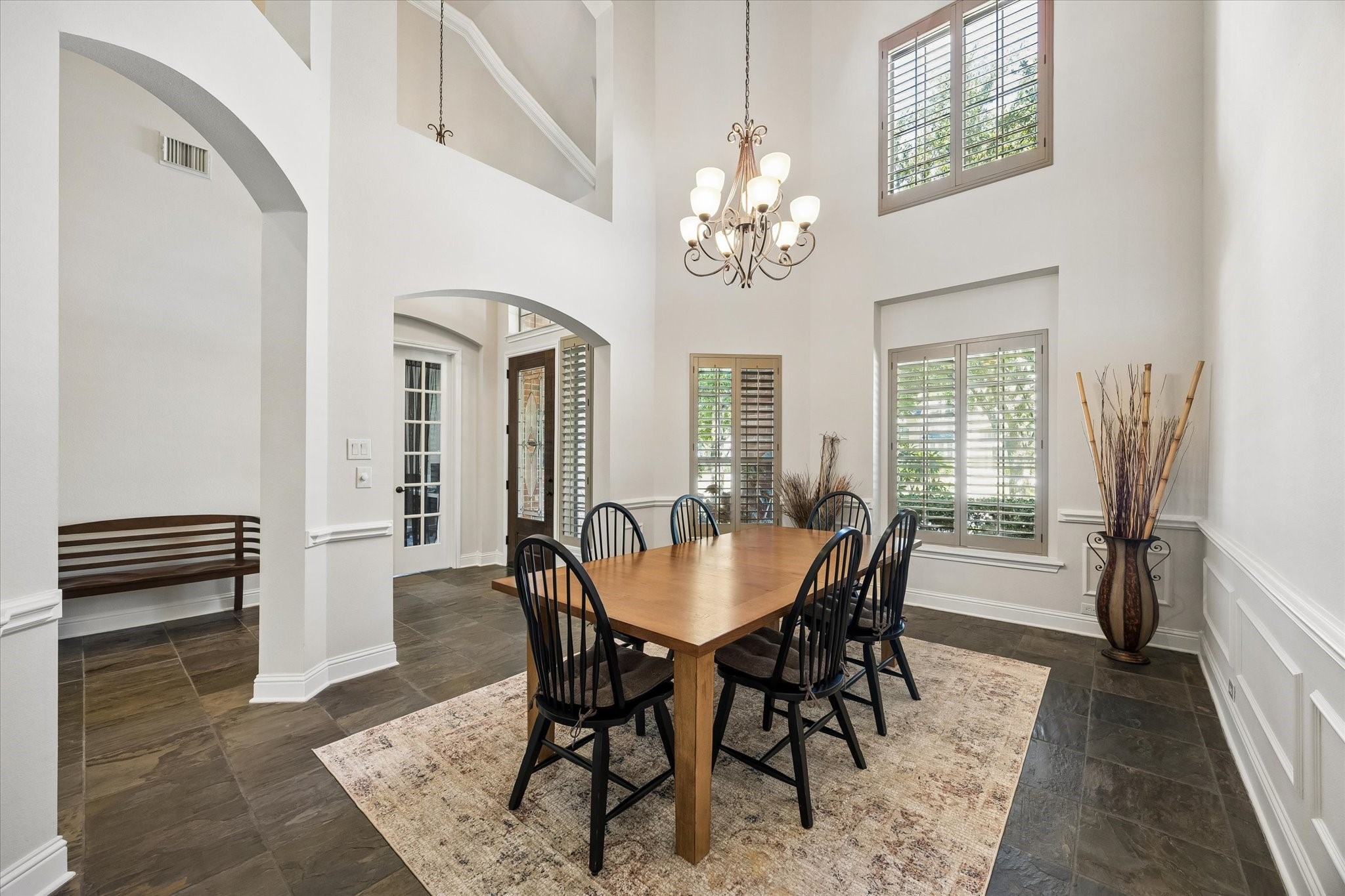 3902 Trailstone Lane Katy, TX 77494 - Photo 8 of 50 Grand in scale yet warm and inviting, this beautiful dining room offers elegant architectural details, gorgeous natural light, and all the space you need to host everything from intimate dinners to lively family gatherings.