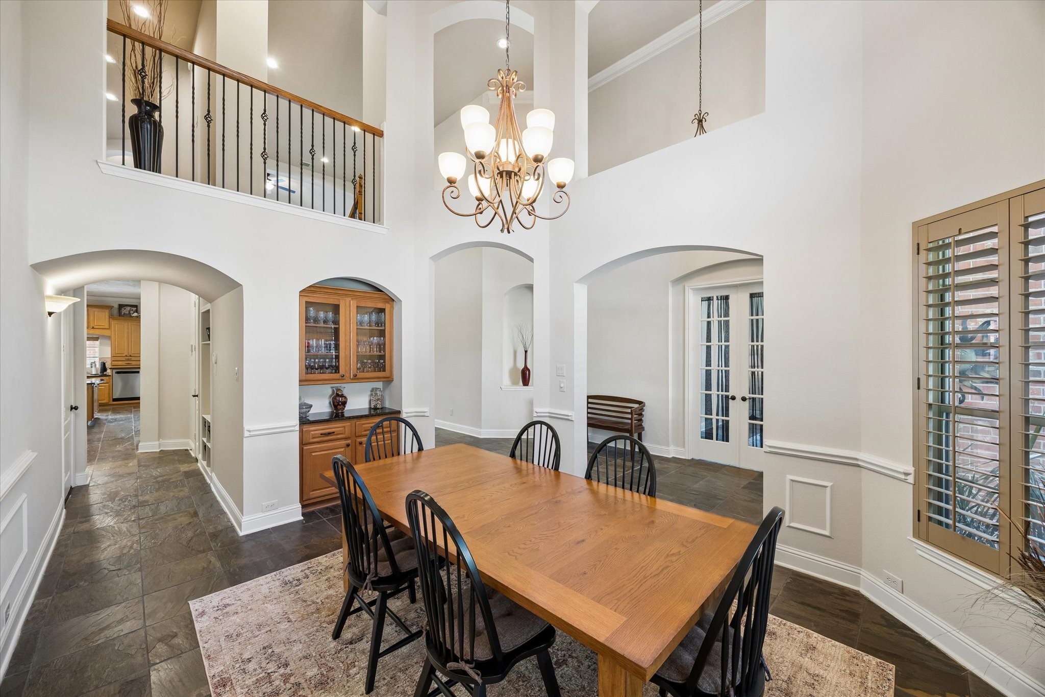 3902 Trailstone Lane Katy, TX 77494 - Photo 9 of 50 With its built-in buffet, soaring ceiling, striking chandelier, slate flooring, and arched doorways, this formal dining room is ready to make every gathering feel a extraordinary.