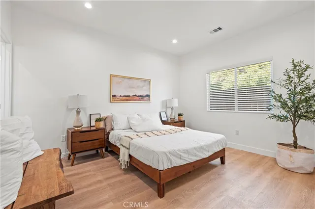 a bedroom with a bed and window