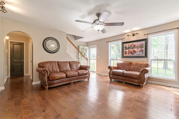 a living room with furniture and a large window