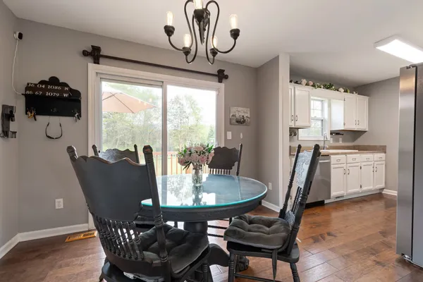 a view of a dining room with furniture window and outside view