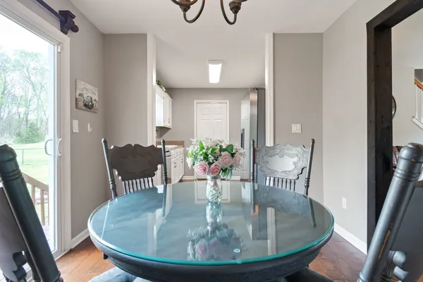 a view of a dining room with furniture and wooden floor