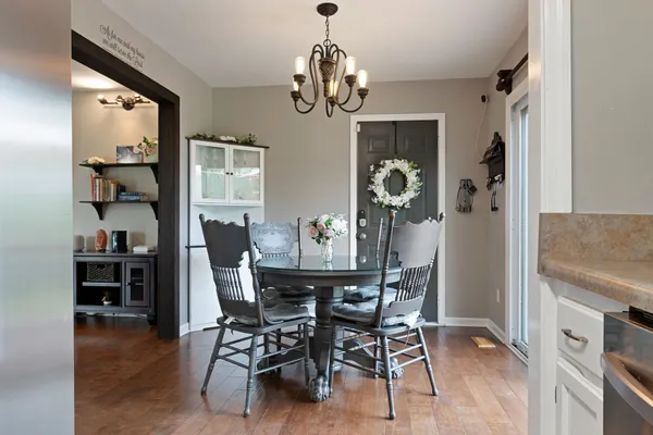 a view of a dining room with furniture window and wooden floor