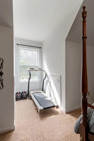 a view of a livingroom with furniture and a ceiling fan