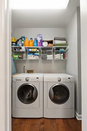 a view of balcony with wooden floor and fence