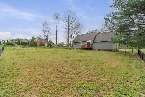a view of a field with sitting area