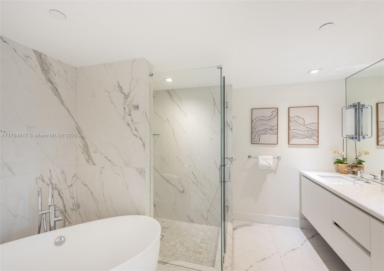 888 Brickell Key Drive, Unit 2501 Miami, FL 33131 - Photo 11 of 39 a bathroom with a sink a toilet and shower