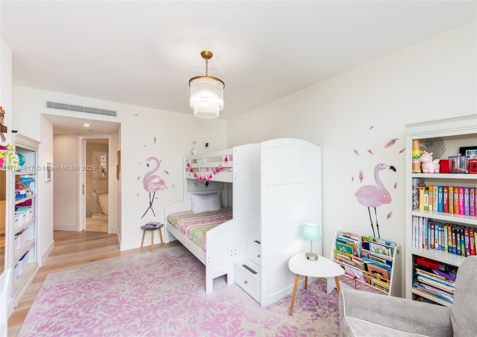 888 Brickell Key Drive, Unit 2501 Miami, FL 33131 - Photo 14 of 39 a living room with furniture and a book shelf