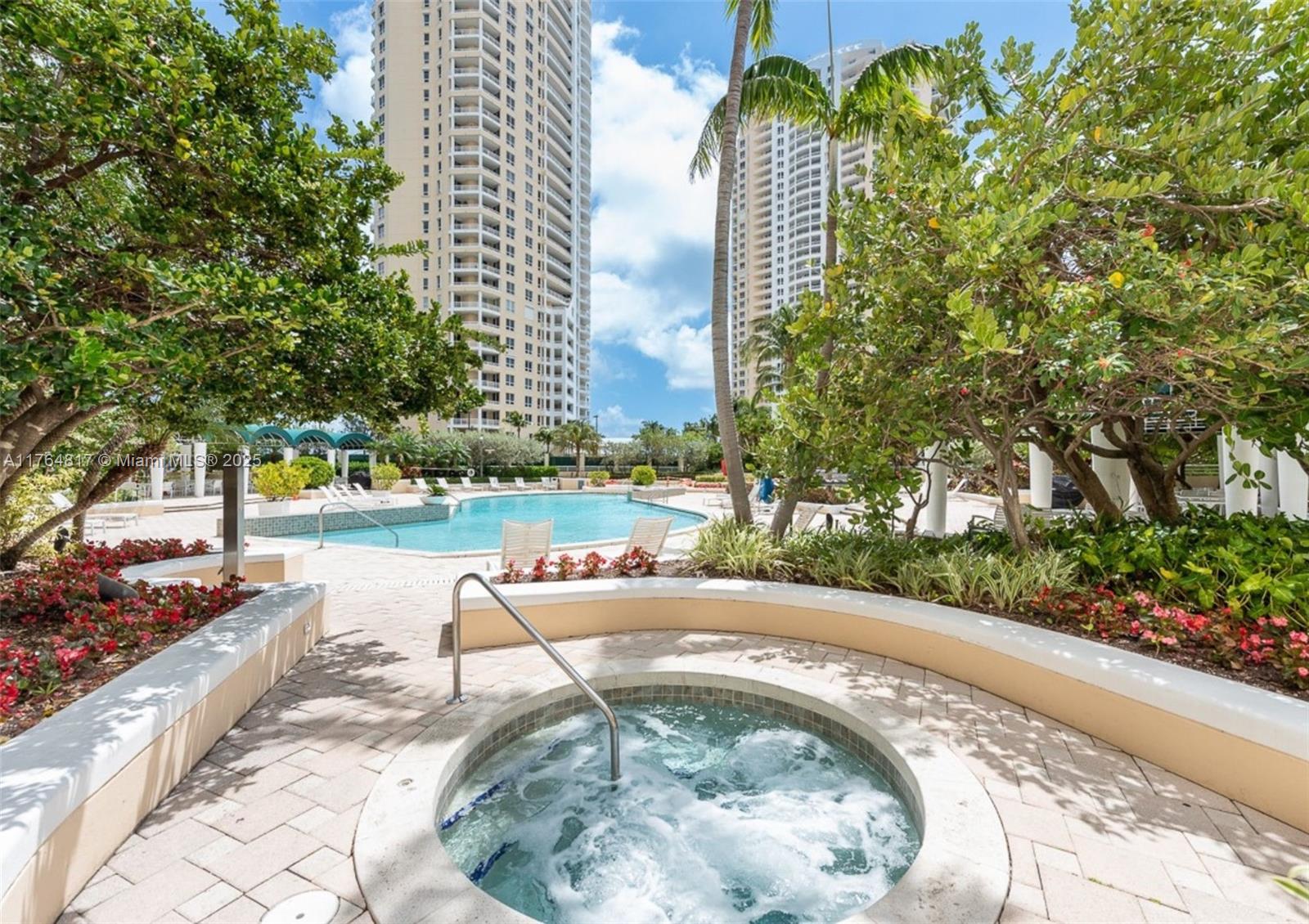 888 Brickell Key Drive, Unit 2501 Miami, FL 33131 - Photo 28 of 39 a view of a swimming pool with a patio