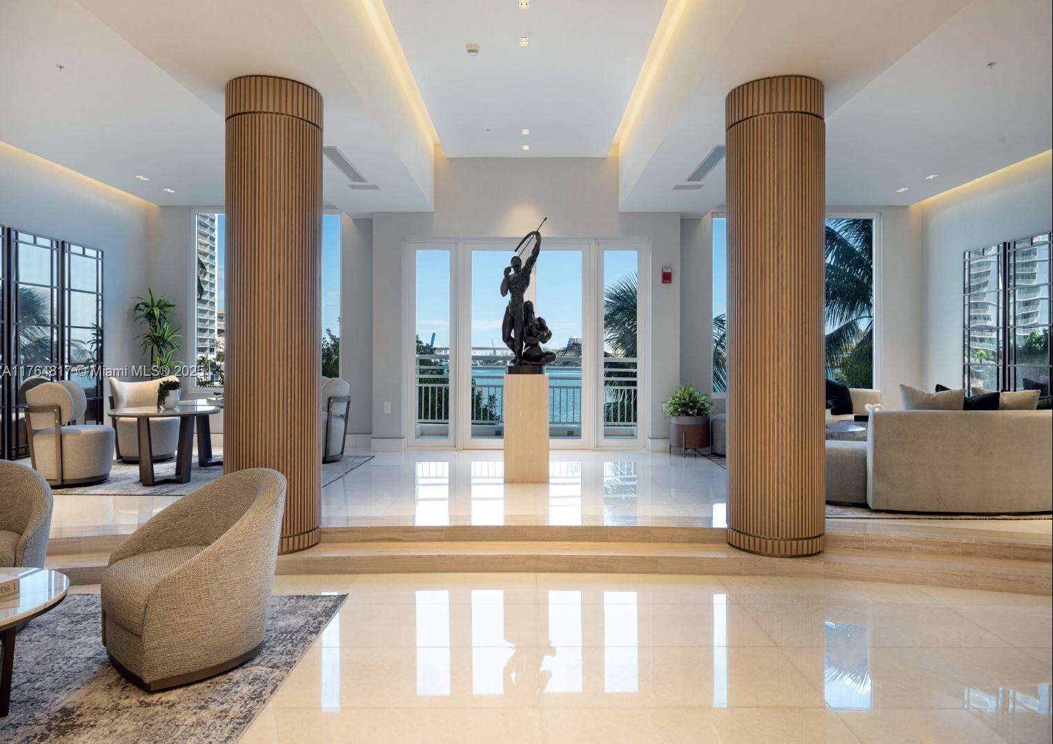 888 Brickell Key Drive, Unit 2501 Miami, FL 33131 - Photo 30 of 39 a living room with furniture and wooden floor