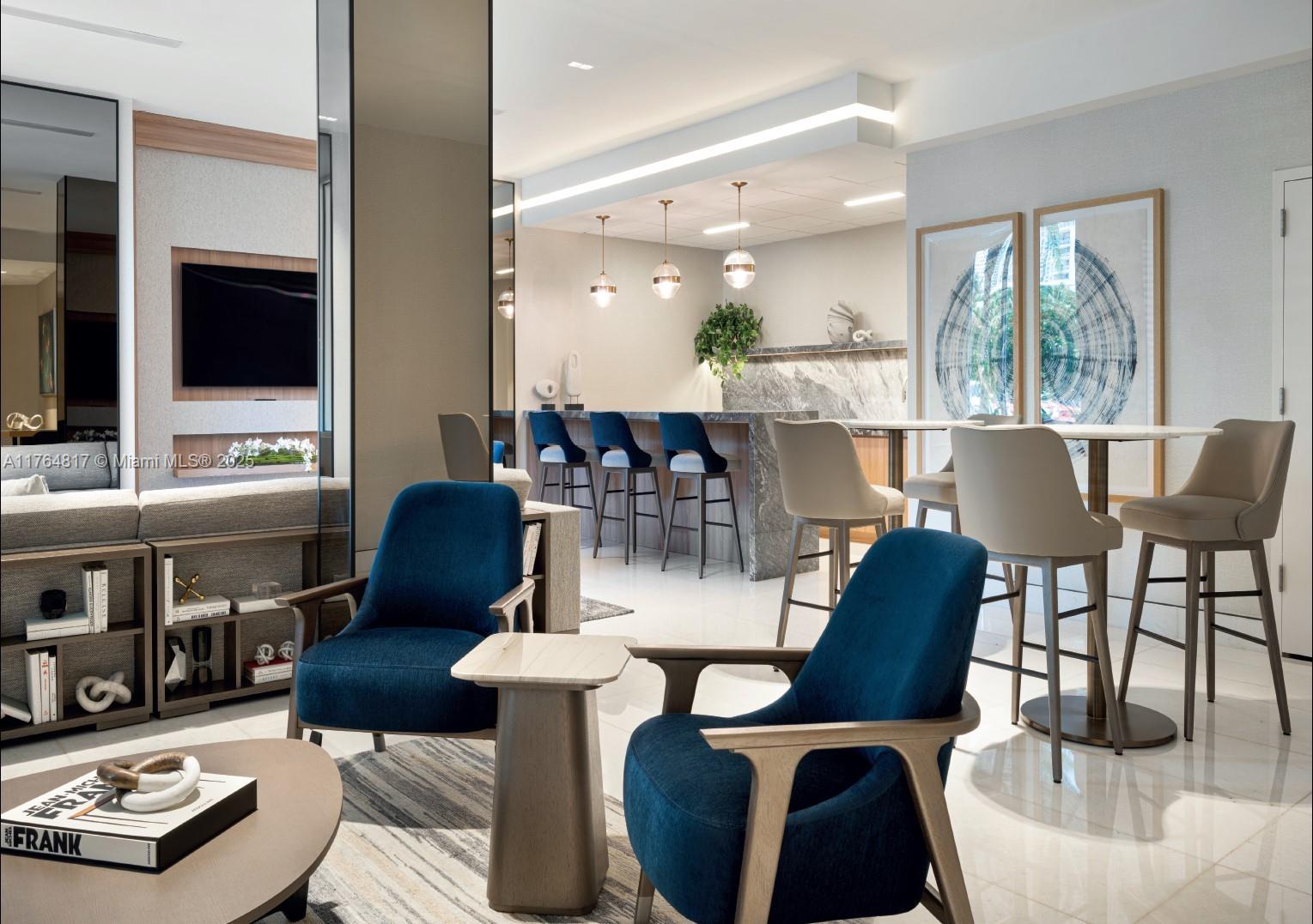 888 Brickell Key Drive, Unit 2501 Miami, FL 33131 - Photo 32 of 39 a living room with furniture and a flat screen tv