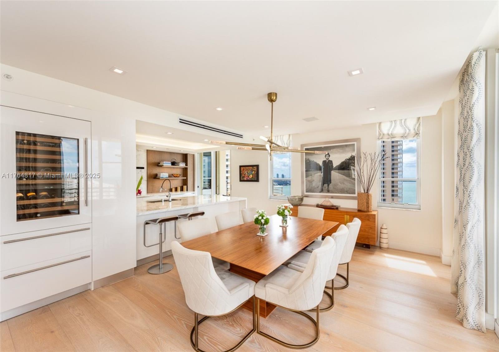 888 Brickell Key Drive, Unit 2501 Miami, FL 33131 - Photo 4 of 39 a dining room with furniture and window