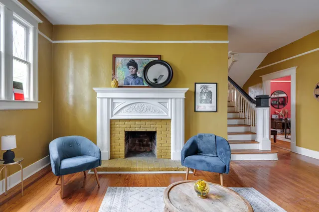 a living room with furniture and a fireplace