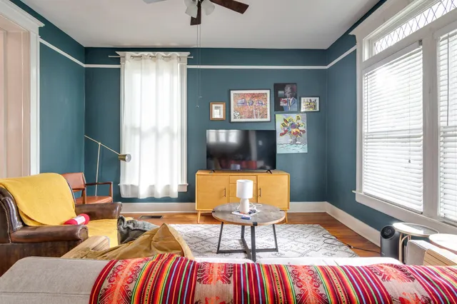 a living room with furniture and a window