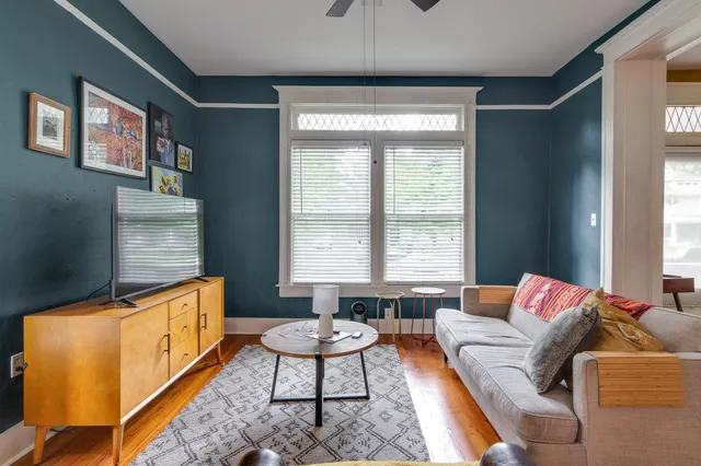 a living room with furniture and a window