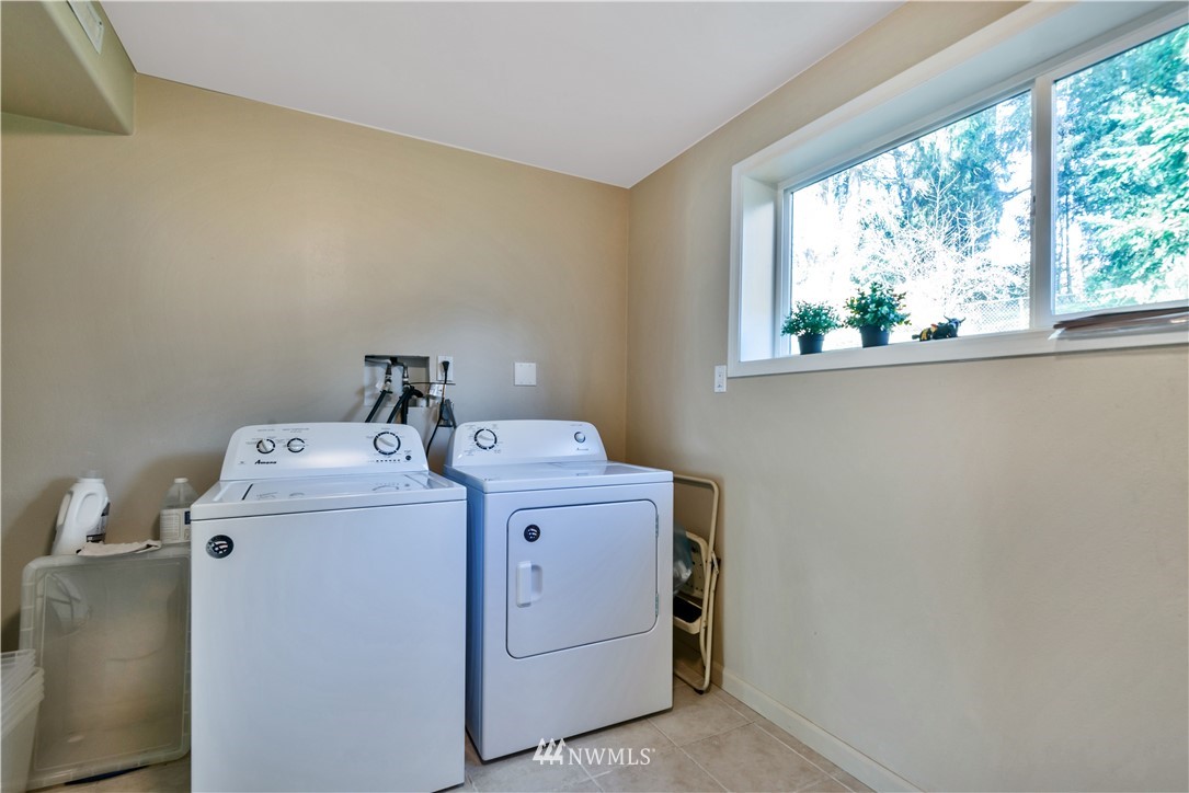 2309 243rd Place Southwest Bothell, WA 98021 - Photo 14 of 18 a utility room with dryer and washer