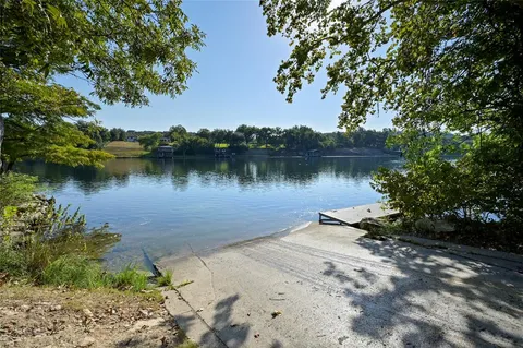 a view of a lake in front of a house