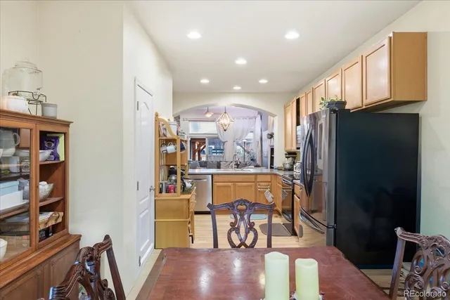 a view of a dining room with furniture and a book shelf