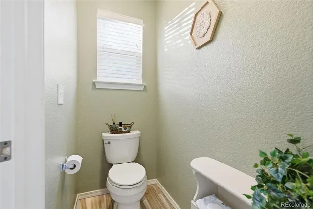 a bathroom with a toilet and a sink