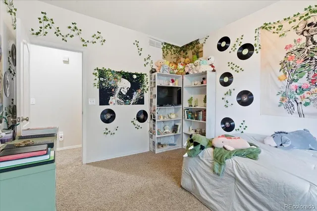 a bedroom with a bed and a table