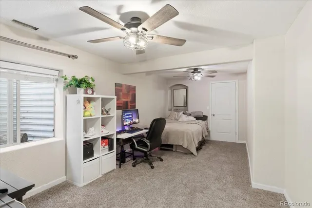 a bathroom with a sink toilet vanity and shower
