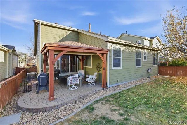 a patio with a table and chairs