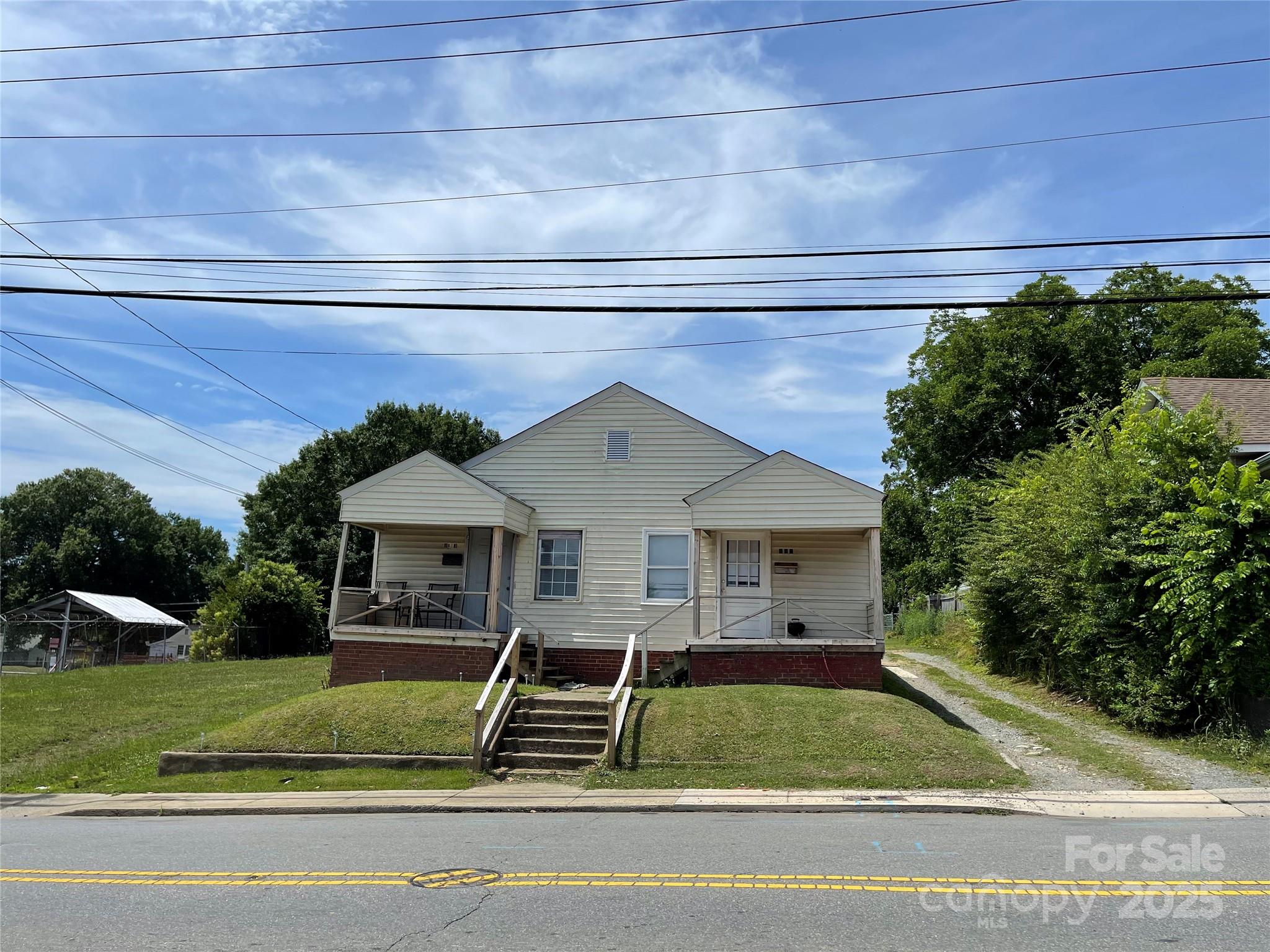 a front view of a house with garden
