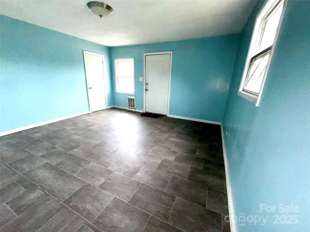 an empty room with windows