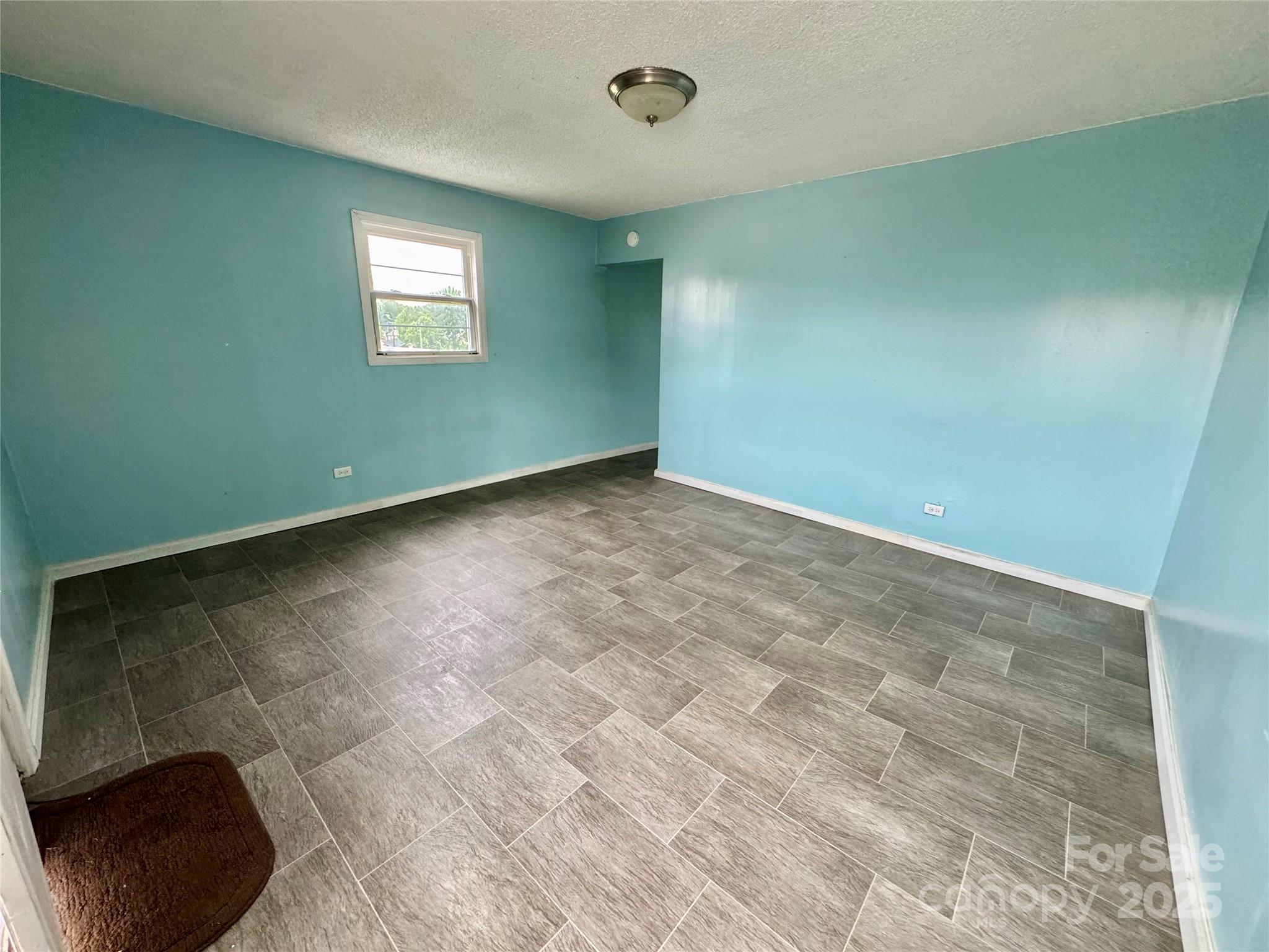 163 Kerr Street Northwest Concord, NC 28025 - Photo 3 of 11 an empty room with windows