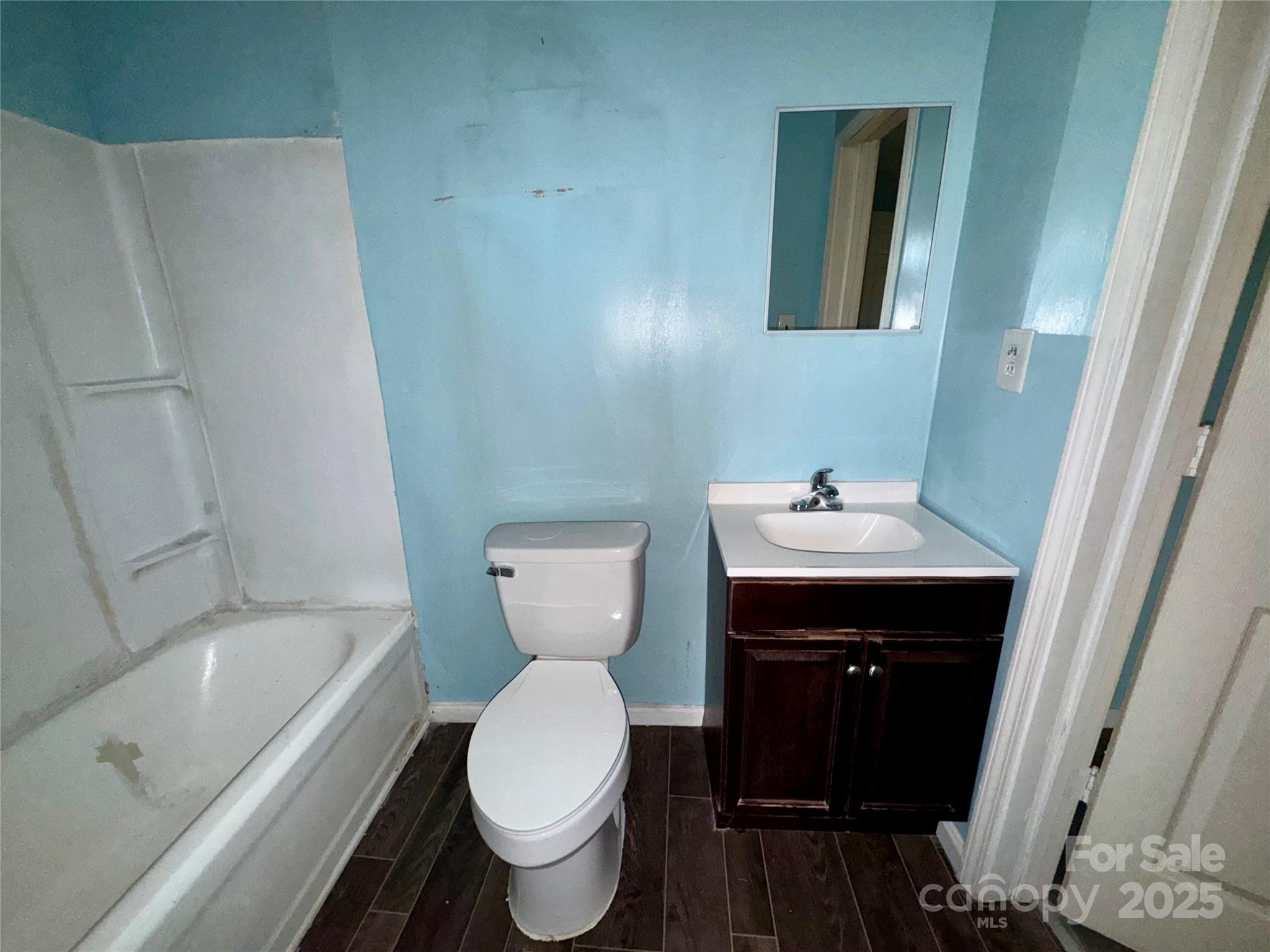 163 Kerr Street Northwest Concord, NC 28025 - Photo 8 of 11 a bathroom with a sink and a mirror