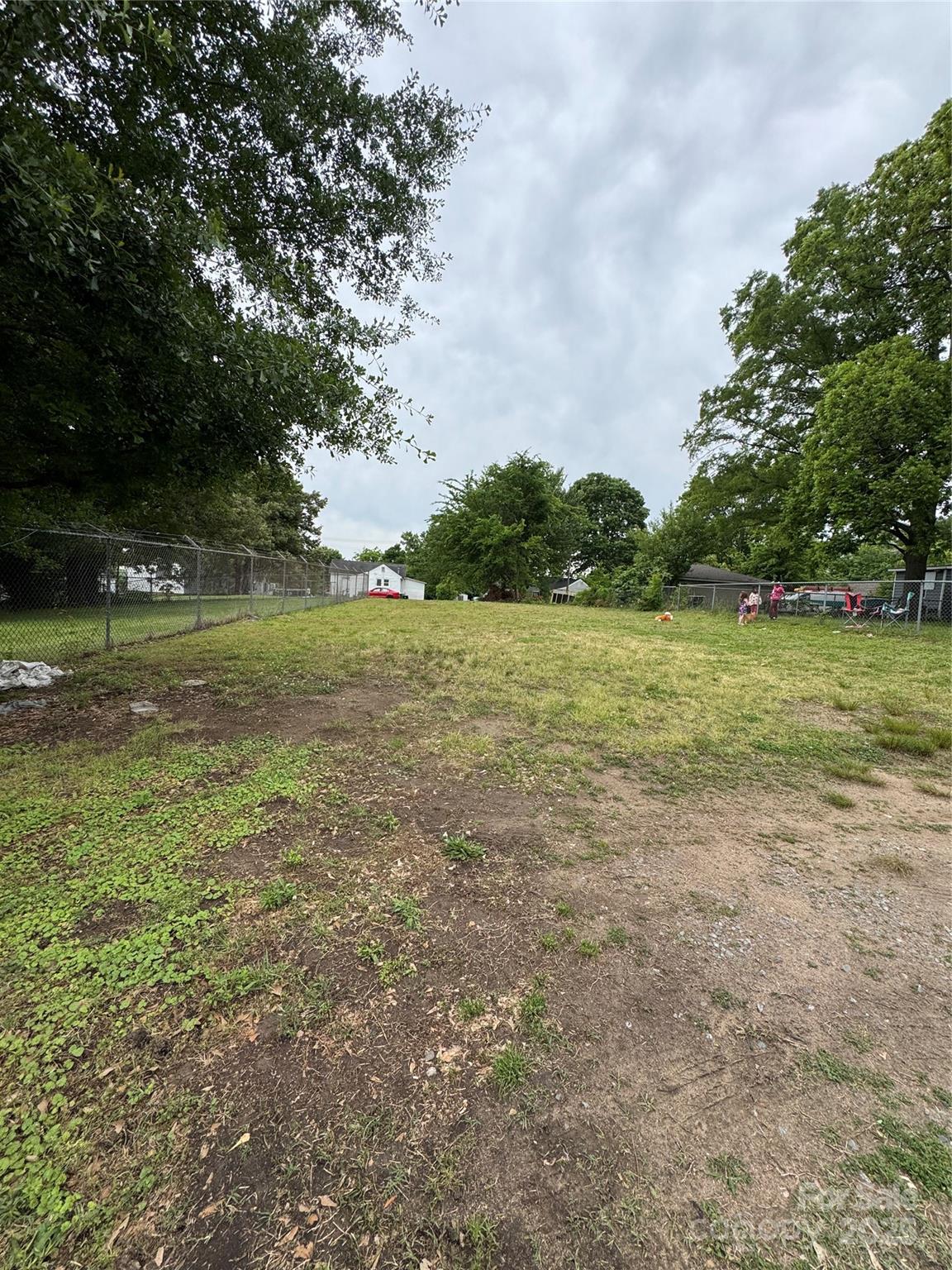 163 Kerr Street Northwest Concord, NC 28025 - Photo 10 of 11 a view of a field with an trees