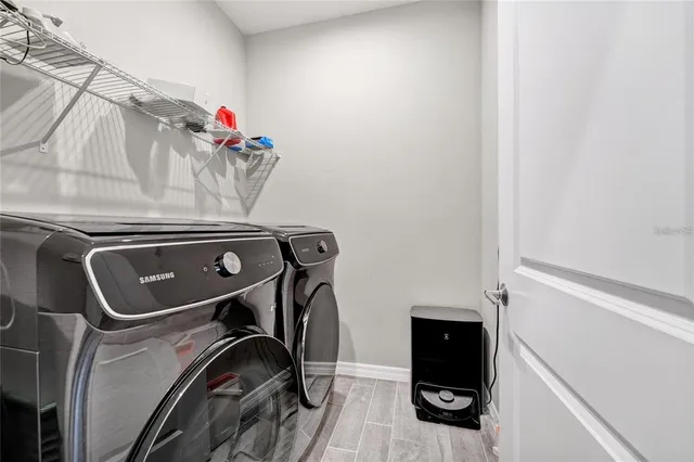 a utility room with dryer and washer