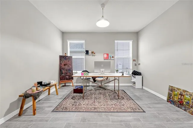 a workspace with furniture and a window