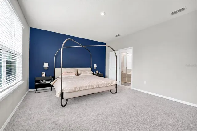 a bathroom with a tub a sink shower and mirror