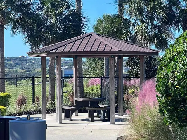 a view of a swimming pool with an outdoor seating