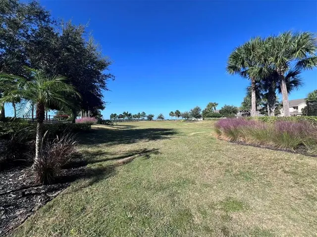 a view of a patio with wooden floor and outdoor seating