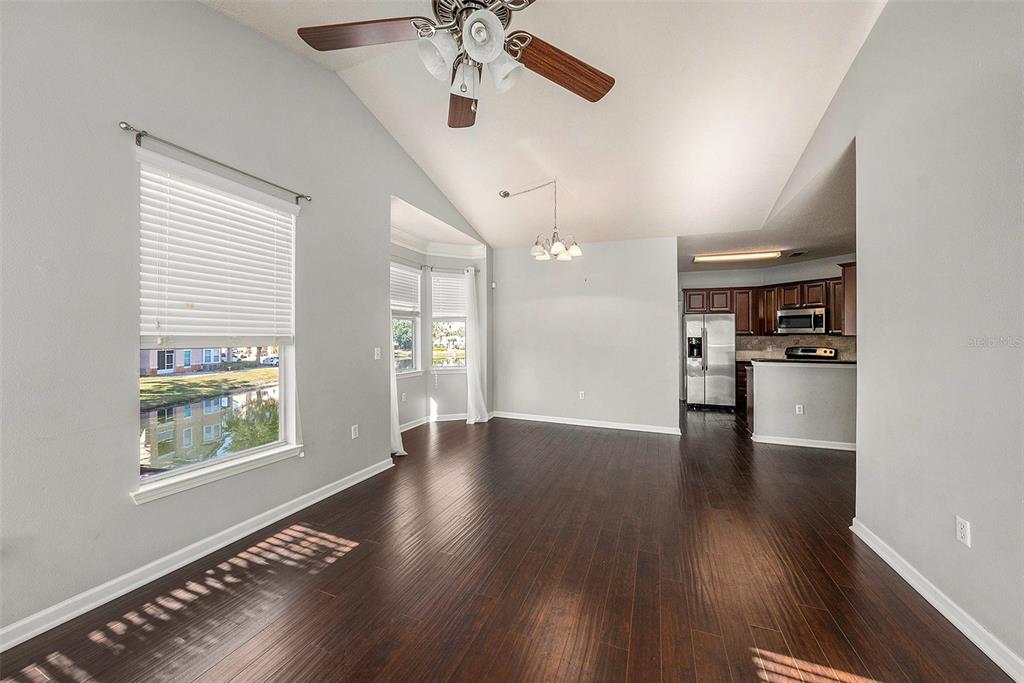 10436 Villa View Circle Tampa, FL 33647 - Photo 6 of 18 a view of an empty room with a window and wooden floor