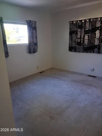 a view of a small space with window and cabinet